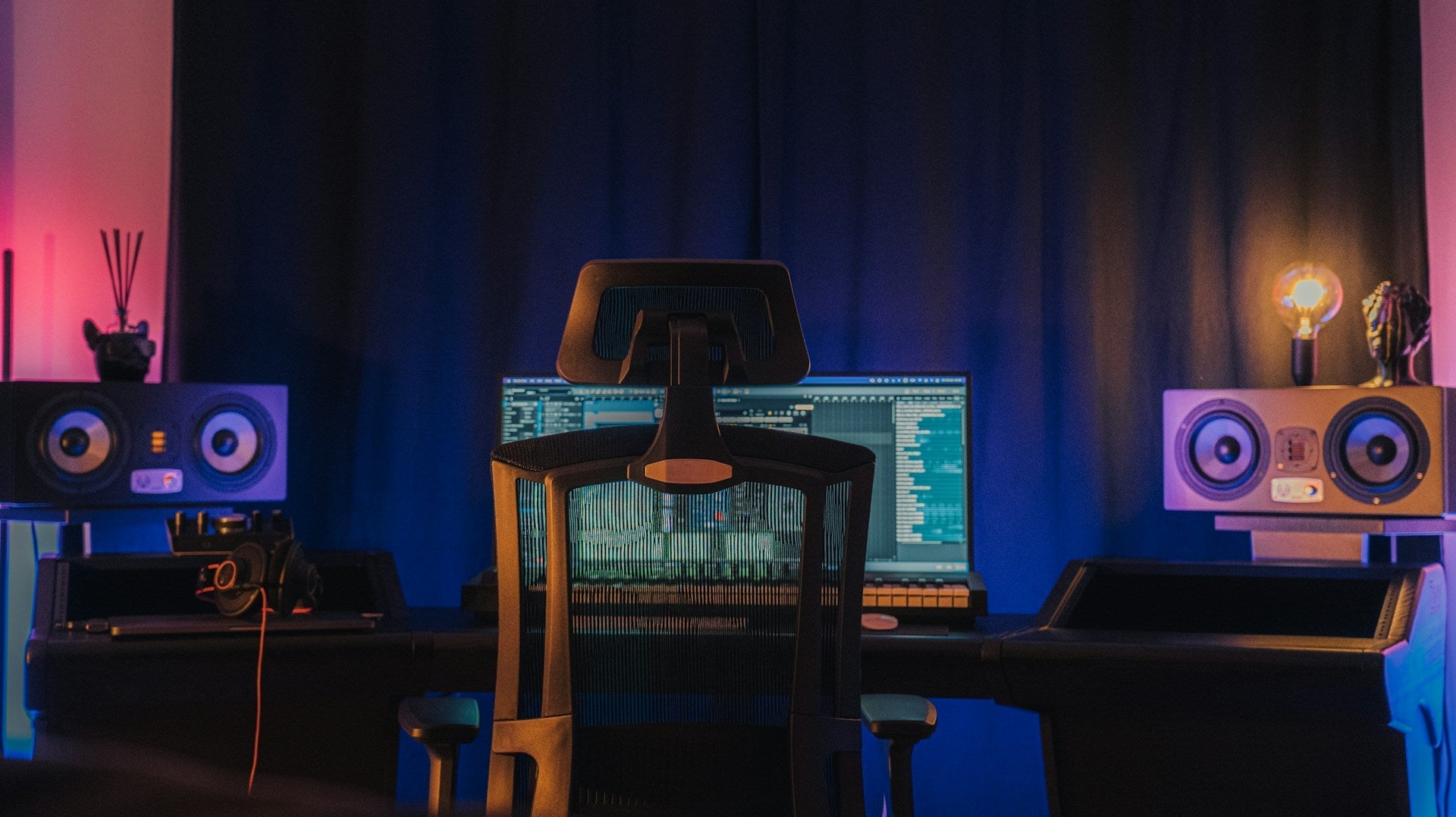 Modern gaming setup with an ergonomic chair in front of a computer, raising the question: are gaming chairs good for your back long-term?