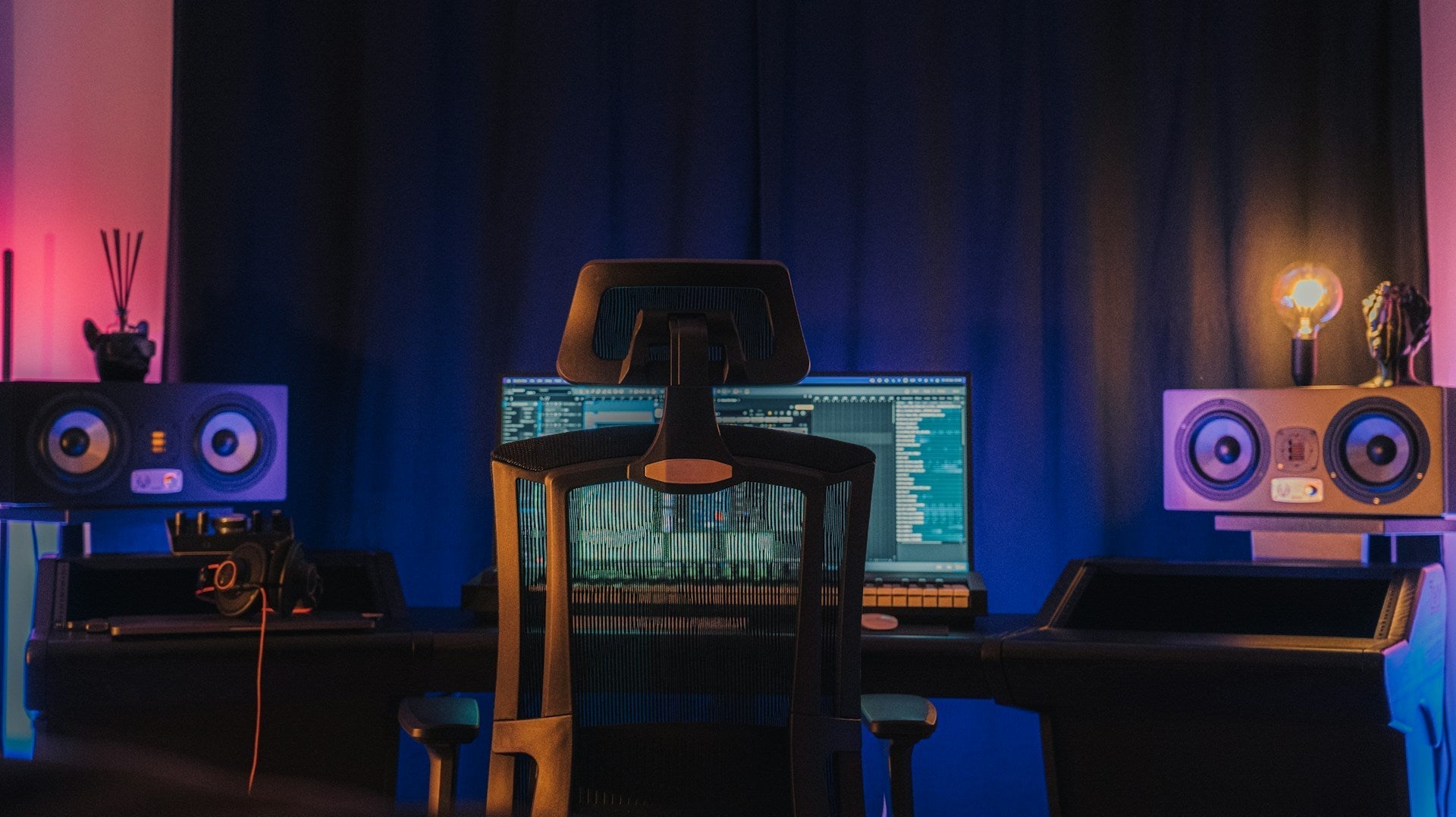 Modern gaming setup with an ergonomic chair in front of a computer, raising the question: are gaming chairs good for your back long-term?