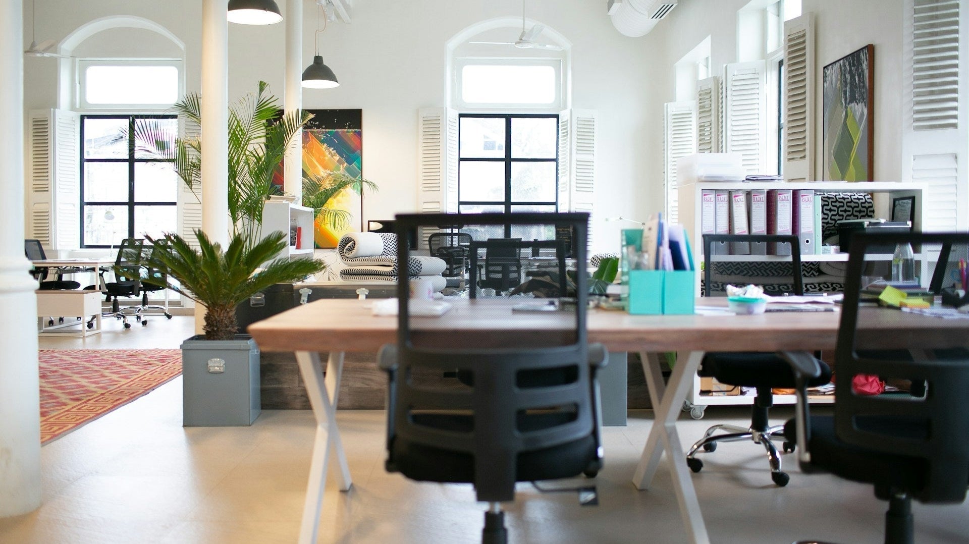 are office chairs good for posture? This pic shows a clean, well-organised office with a black office chair as the subject. Image by Raj Rana via www.unsplash.com