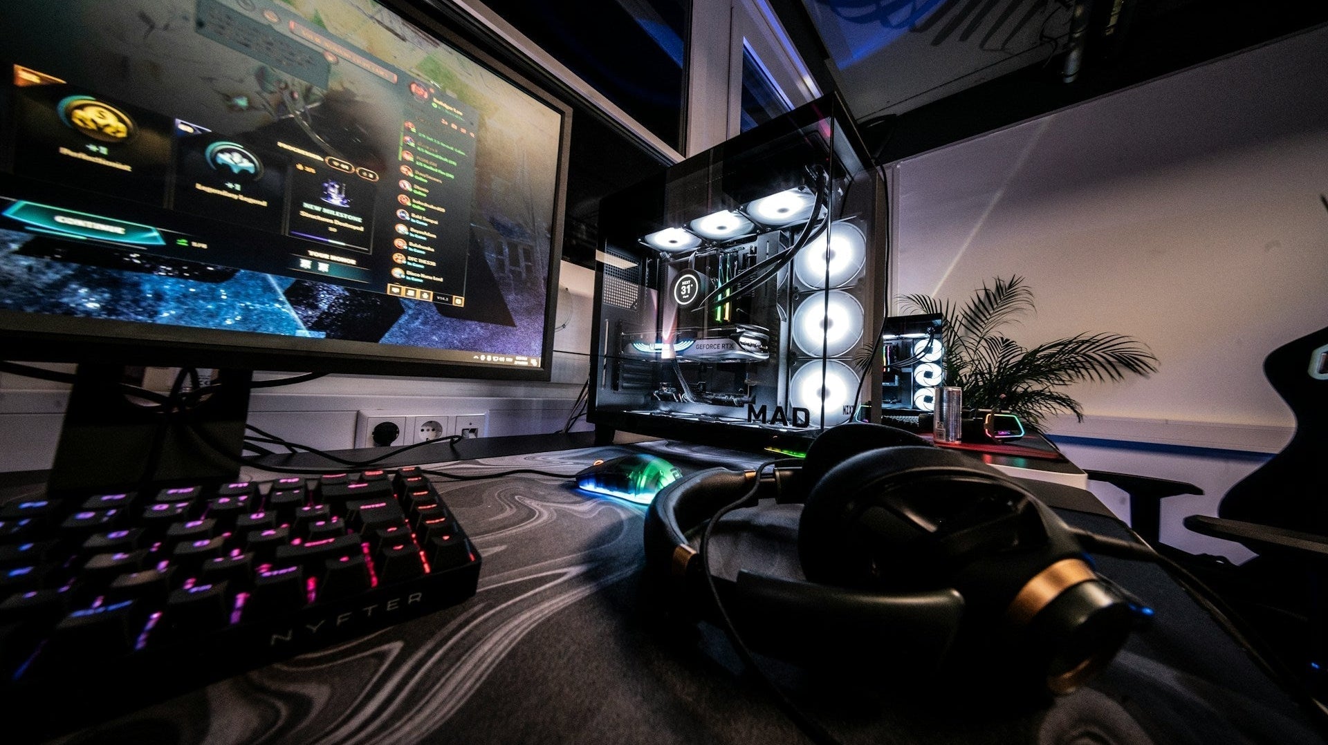 Sleek desktop gaming rig with glowing fans, monitor, and accessories arranged as a stylish cheap gaming setup for players.