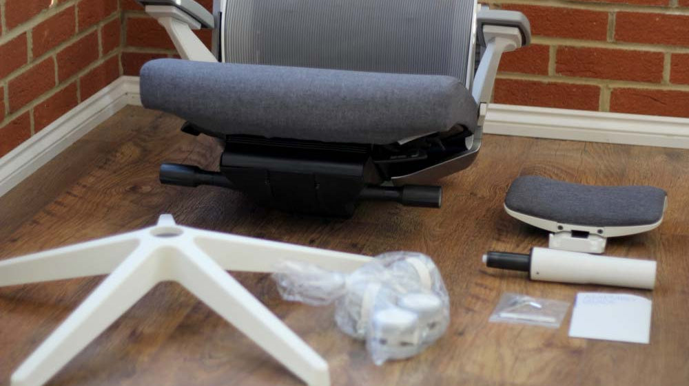 Step-by-step layout of chair parts, ideal for tutorials on how to disassemble office chairs for moving or repair.
