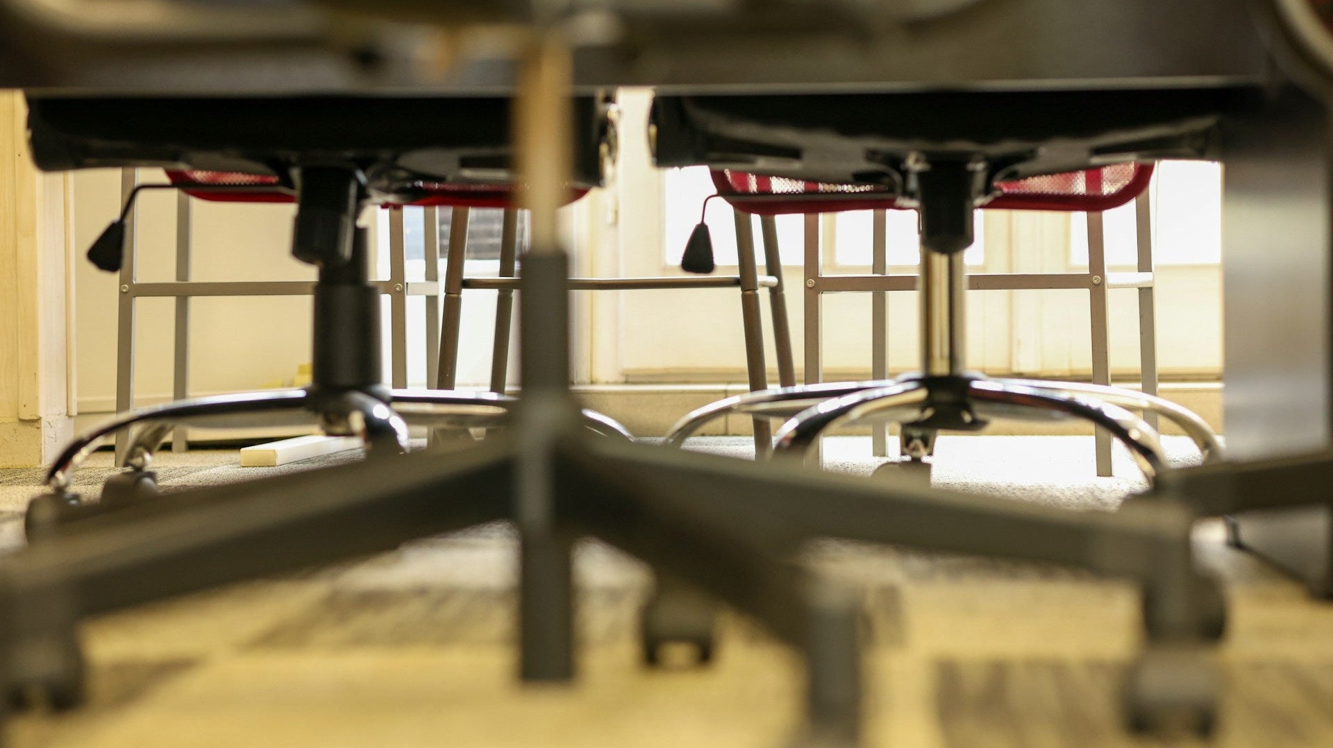 Replacing wheels on office chairs - a group of office chairs focusing on their wheels