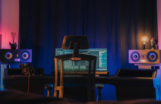 Modern gaming setup with an ergonomic chair in front of a computer, raising the question: are gaming chairs good for your back long-term?