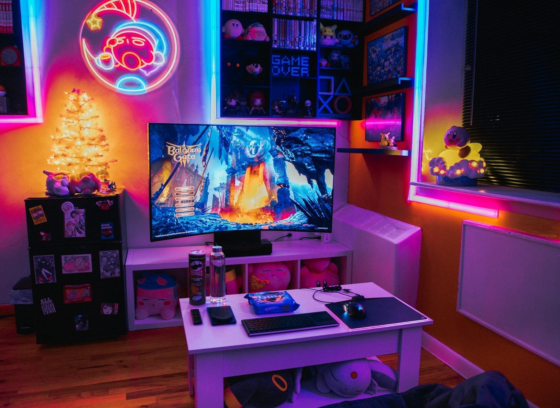 Vibrant gaming room with RGB lighting, plush toys, and a large screen showcasing creative gaming room decor ideas.