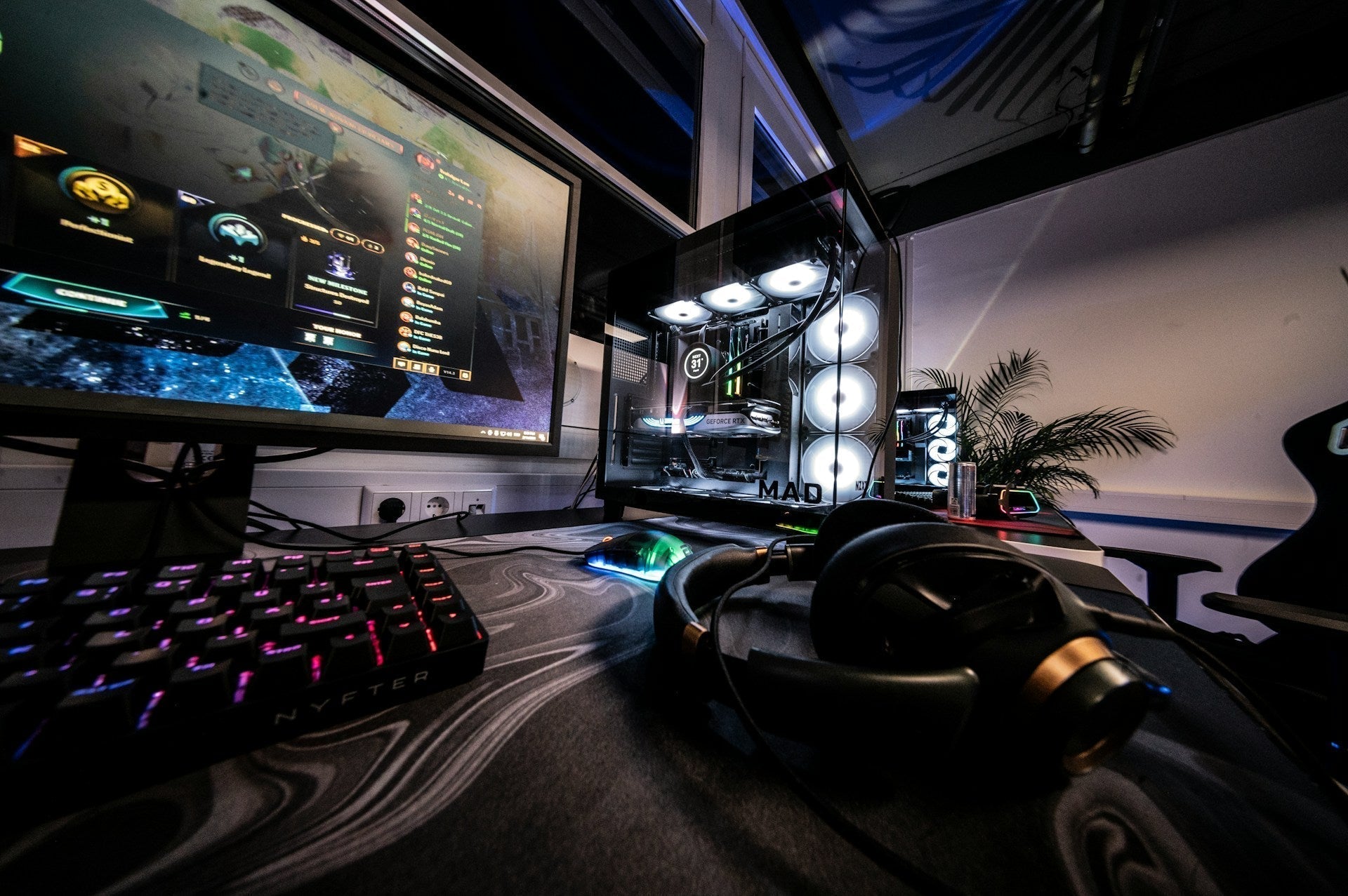 Sleek desktop gaming rig with glowing fans, monitor, and accessories arranged as a stylish cheap gaming setup for players.