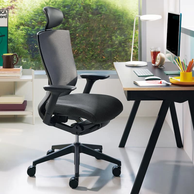 Modern workspace with ergonomic chair and desk, a great example of how to set up an office for comfort.