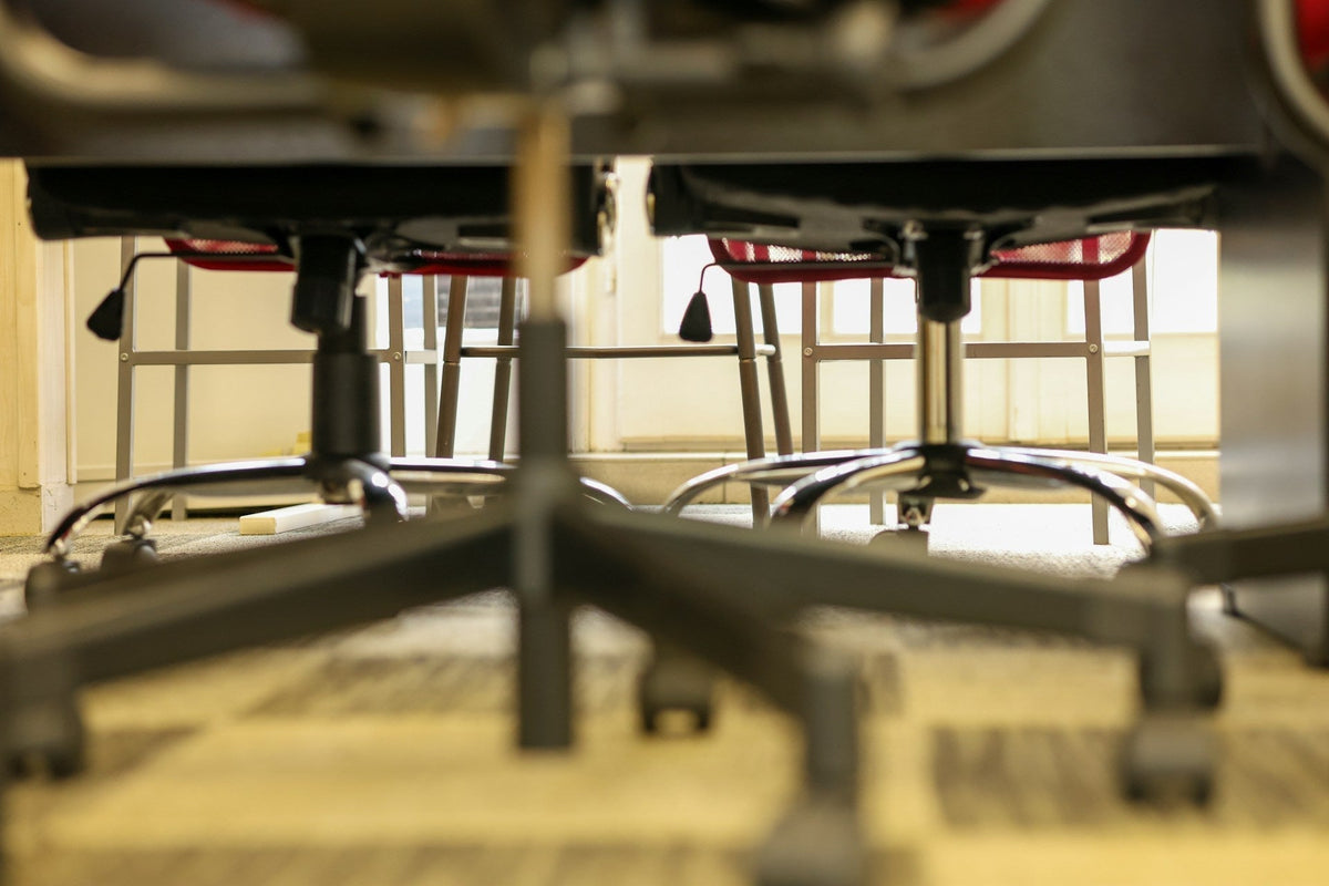 Replacing wheels on office chairs - a group of office chairs focusing on their wheels