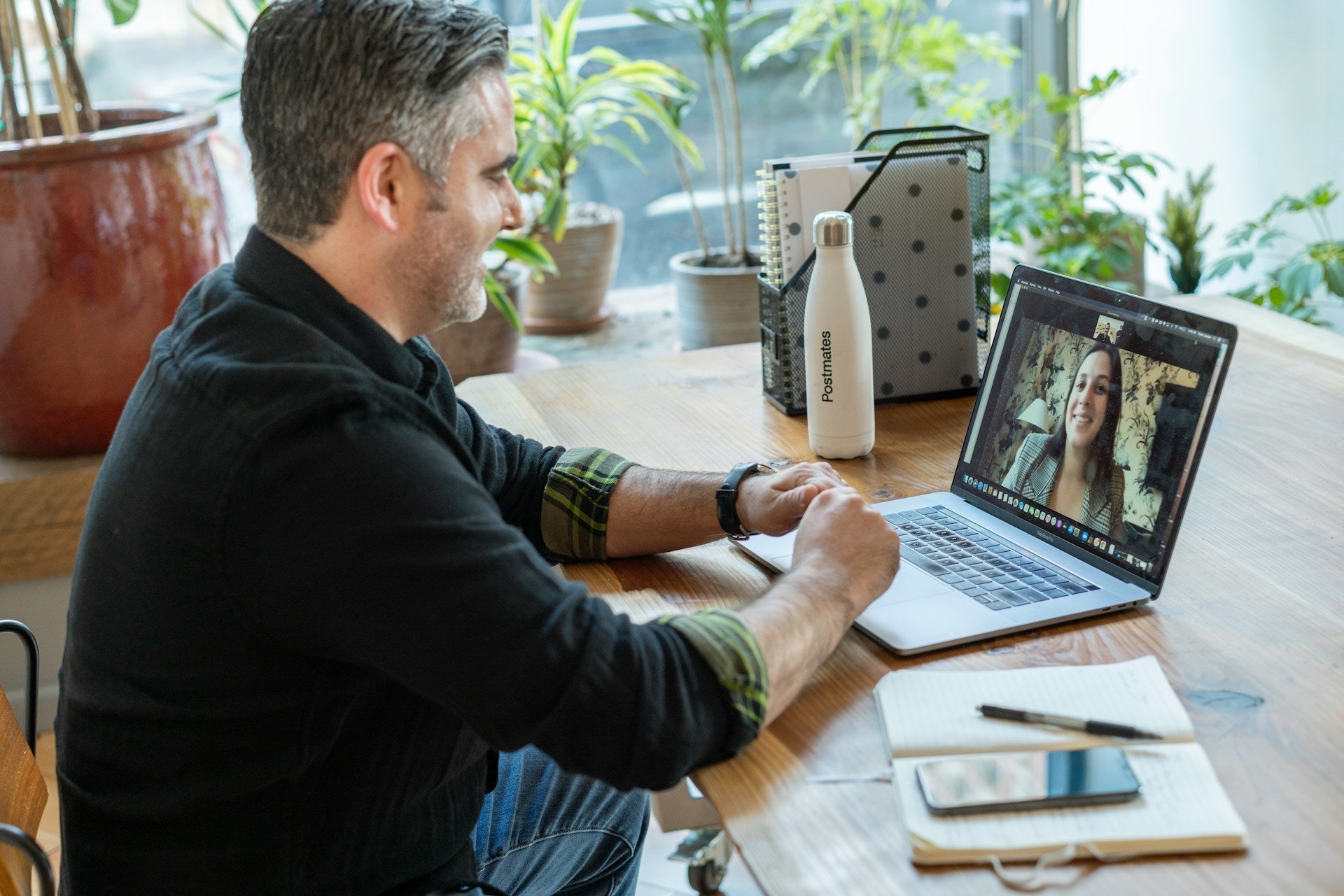 A man in a virtual work meeting for his work from home scientist job. Image by LinkedIn Sales Solutions via www.unsplash.com