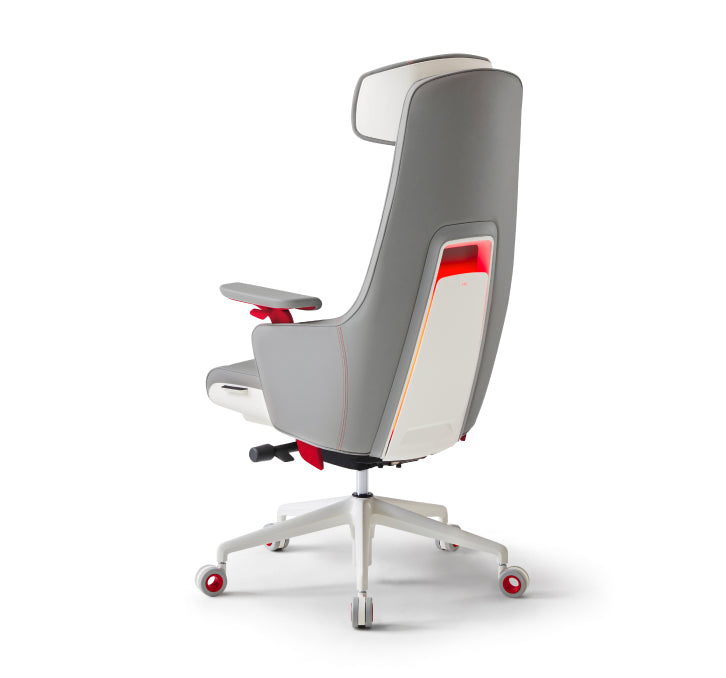 White and grey ergonomic office chair with high backrest, adjustable armrests, and red accent details on a wheeled base